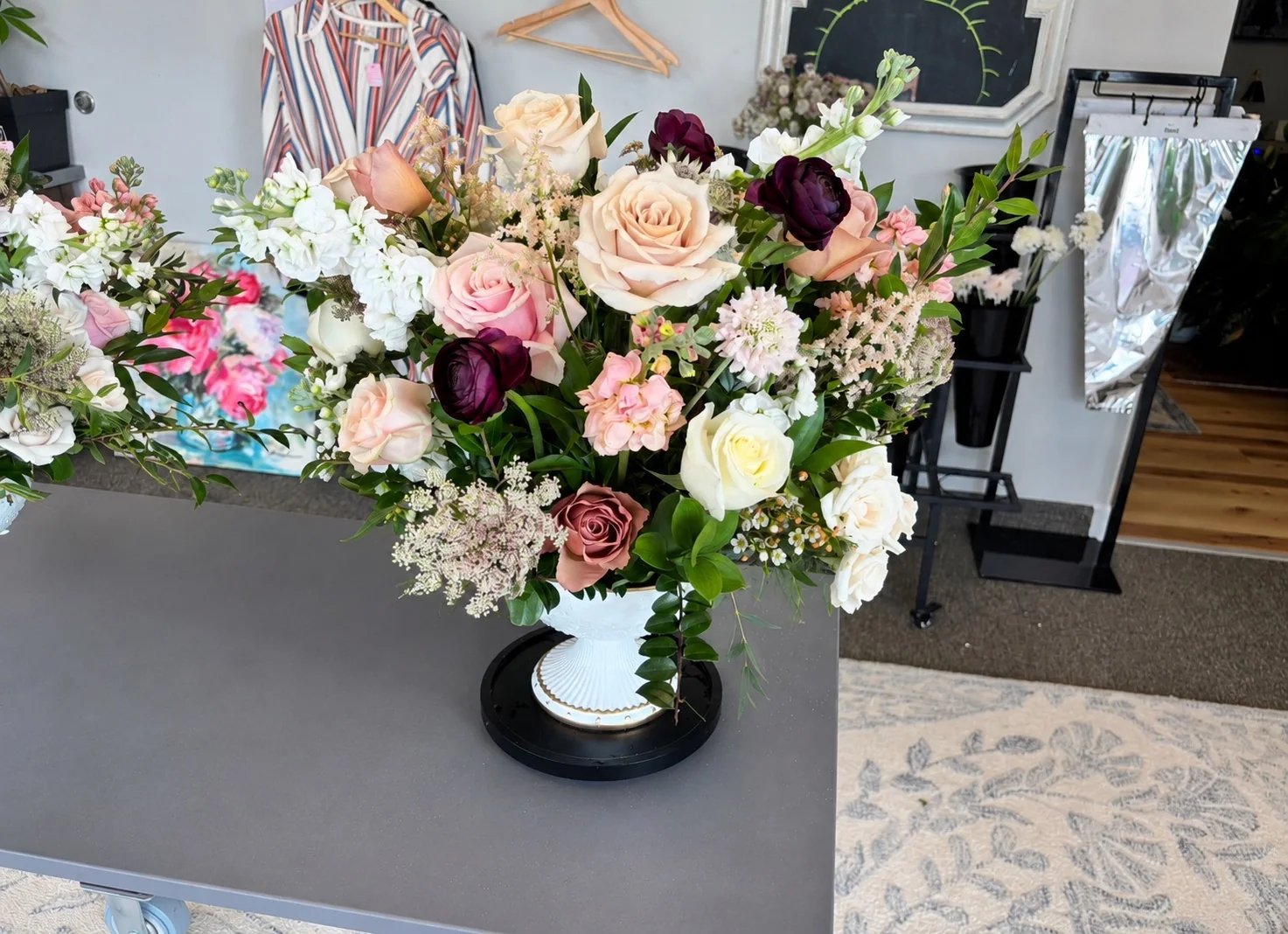 Custom memorial flower arrangement in blush cream and deep seasonal tones designed by A Ray of Sunshine Floral